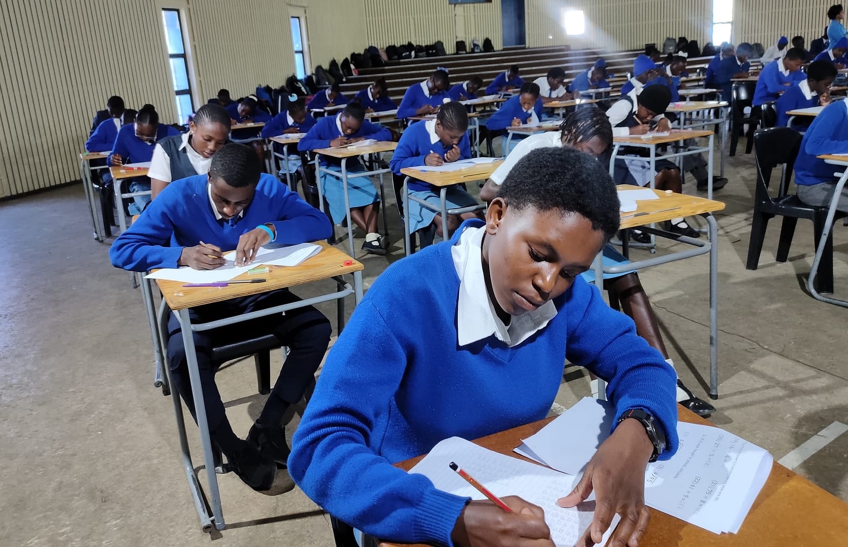 Students in an exam hall.